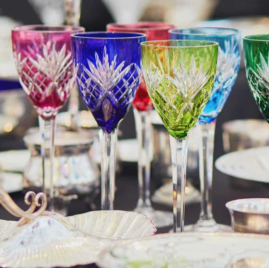Colorful cut crystal wine glasses on table