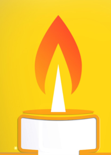 Lit candle with orange flame on yellow background