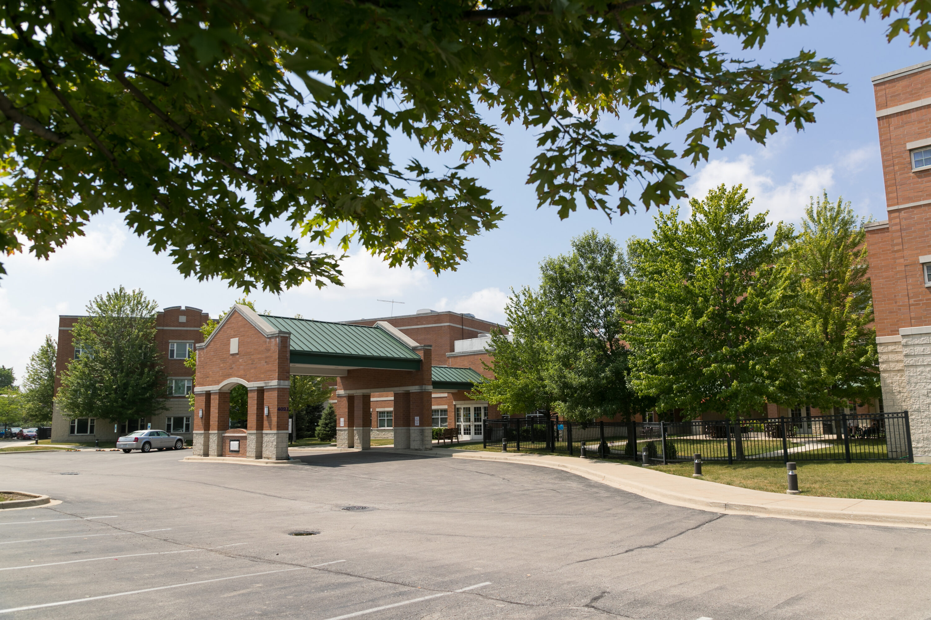 Brick building with green roof entrance canopy
