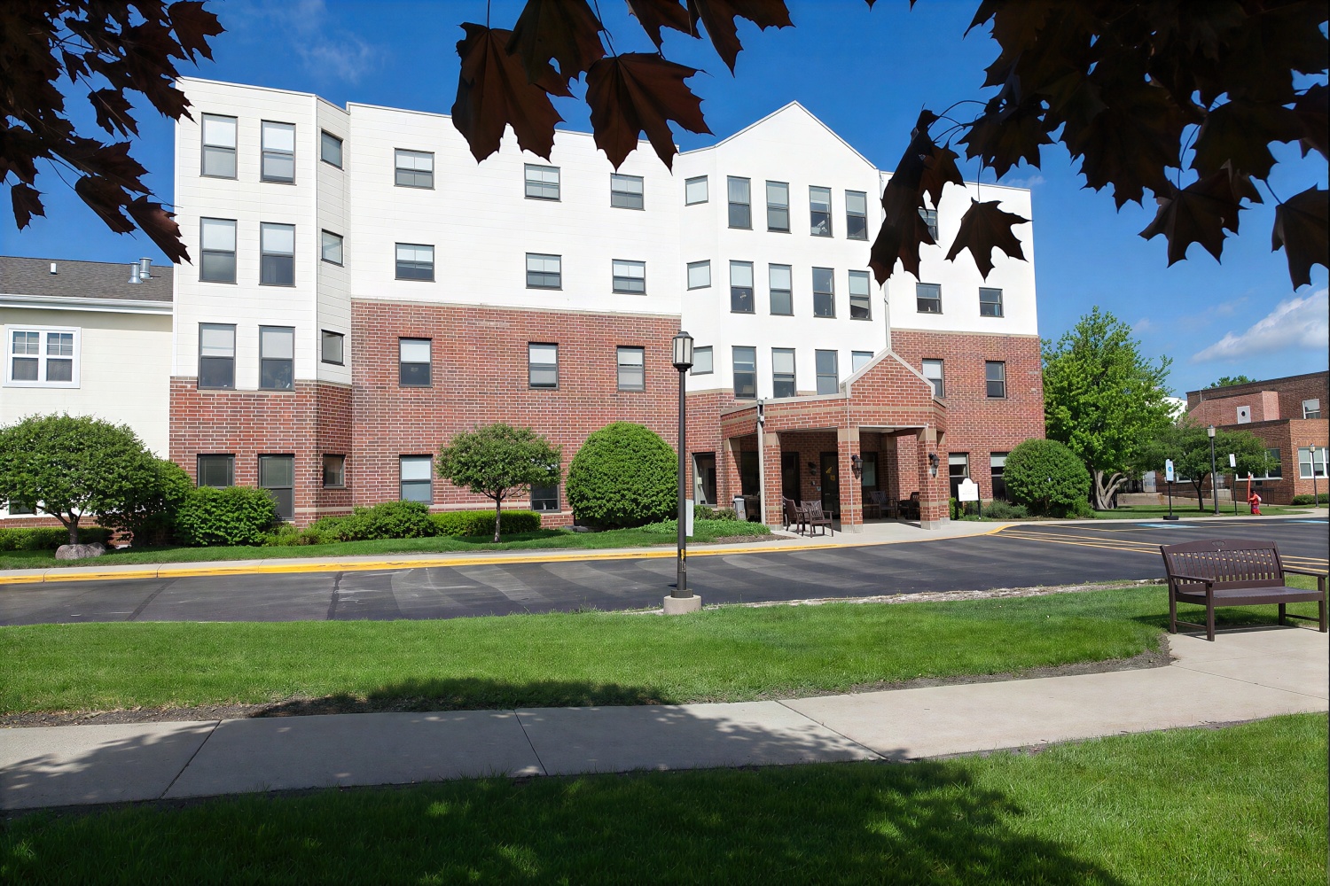 Three-story brick and siding apartment building exterior