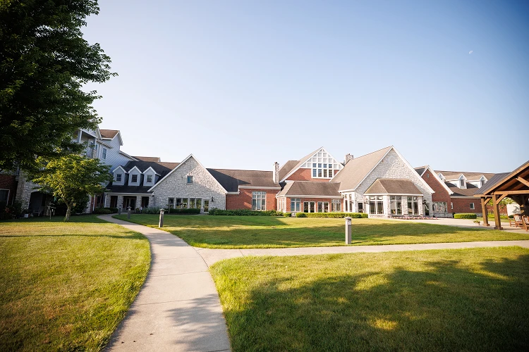 Large suburban residential building with landscaped lawn