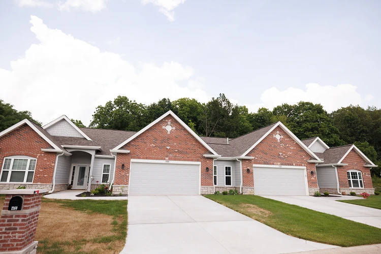 Row of brick townhomes with attached garages