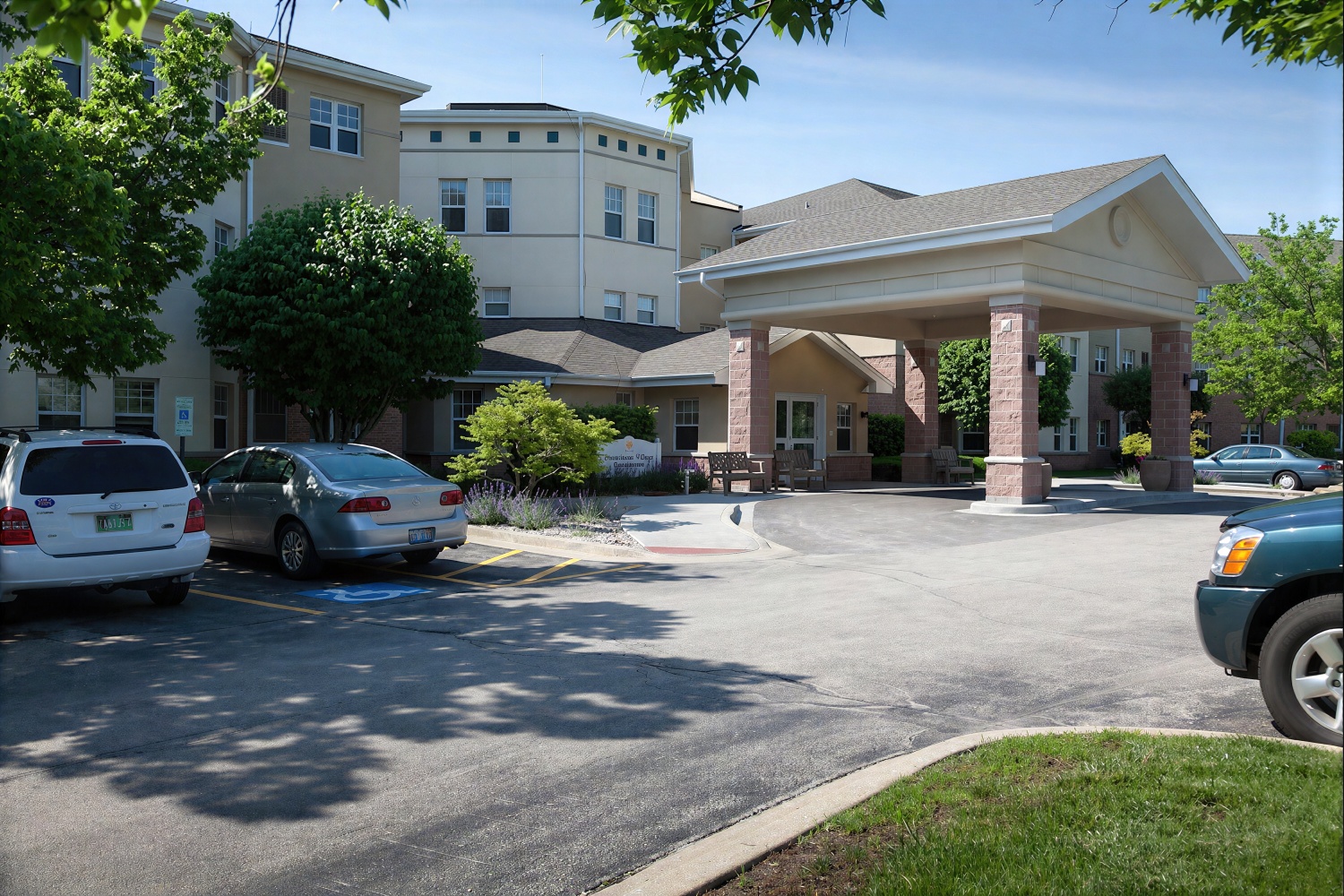 Senior living facility entrance with covered drop-off