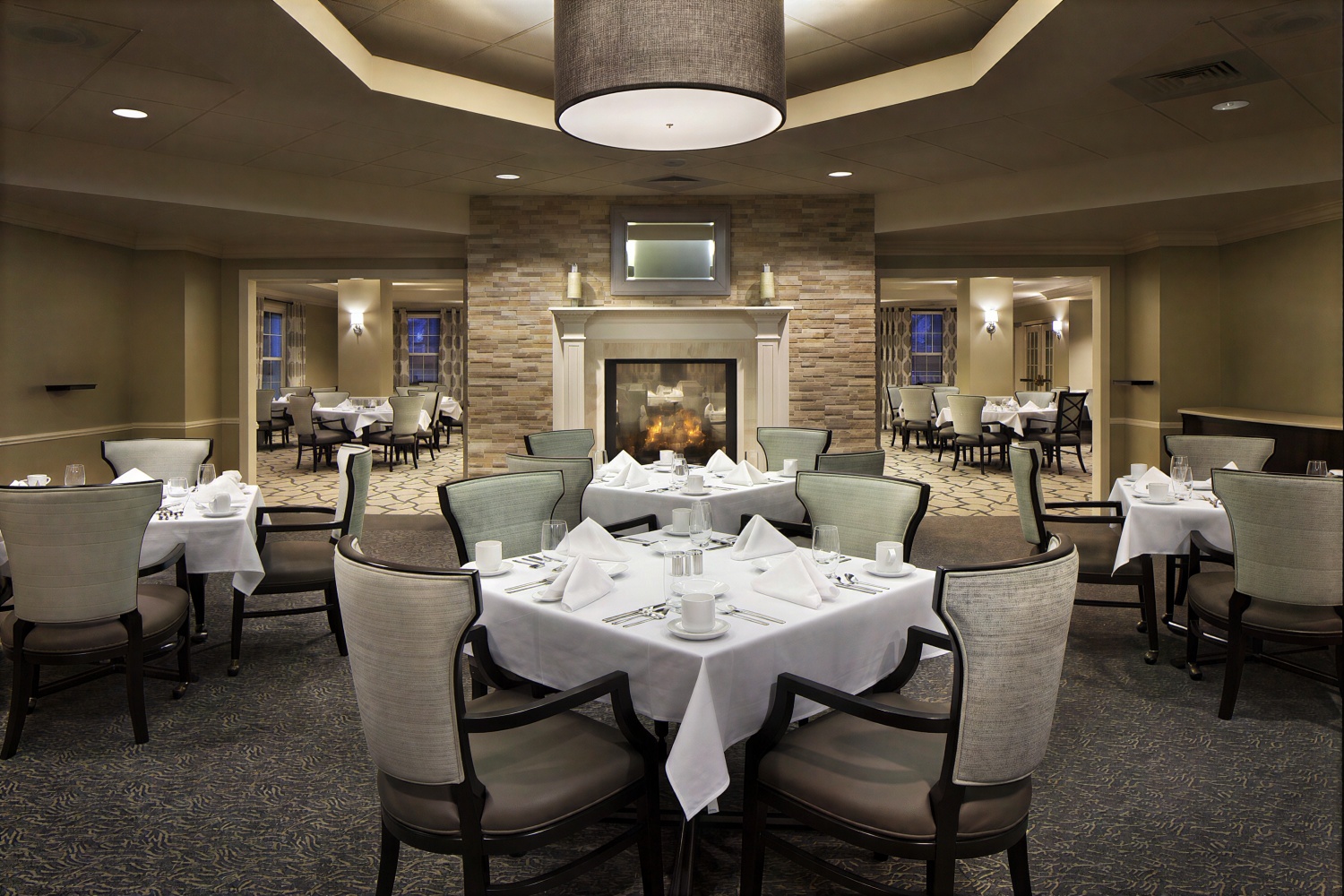 Elegant dining room with fireplace and round tables