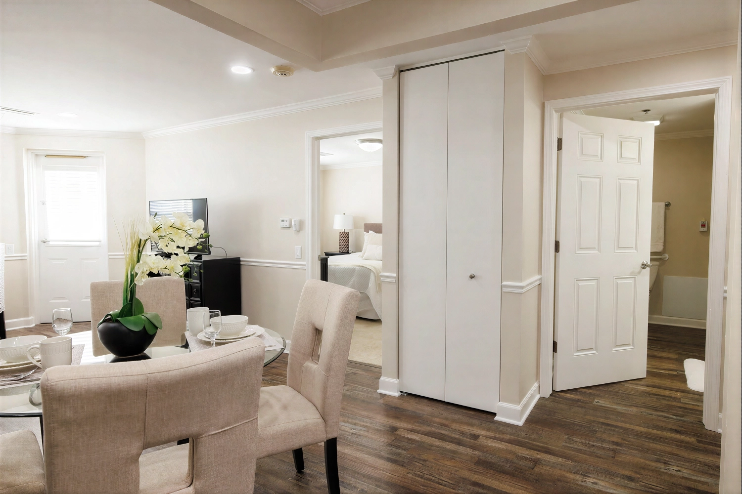 Modern apartment dining area with bedroom and bathroom