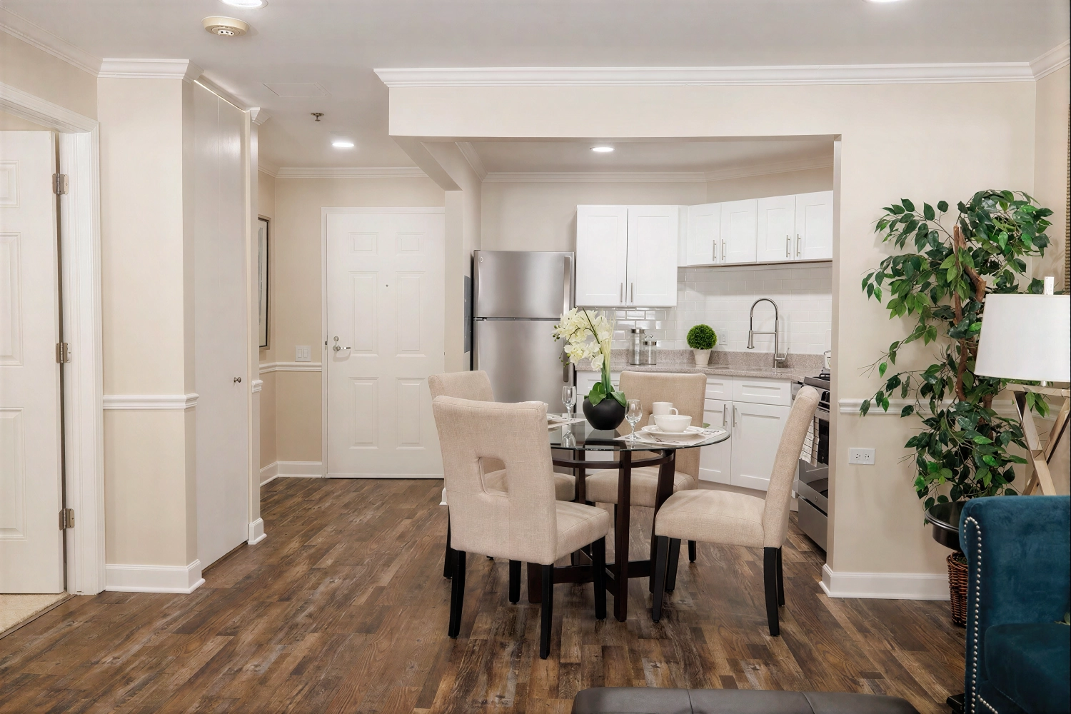 Modern kitchen and dining area with glass table