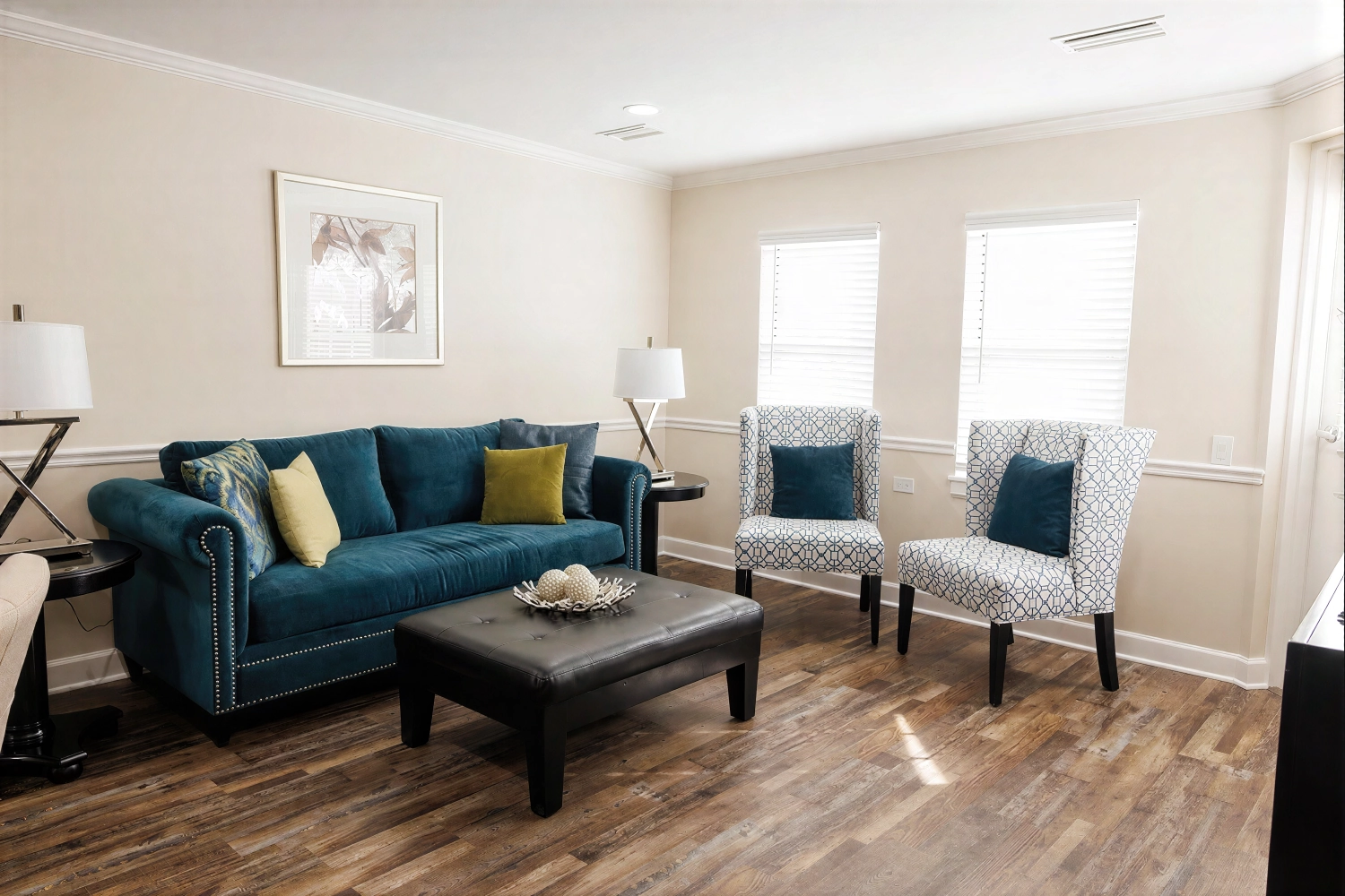 Modern living room with teal sofa and chairs
