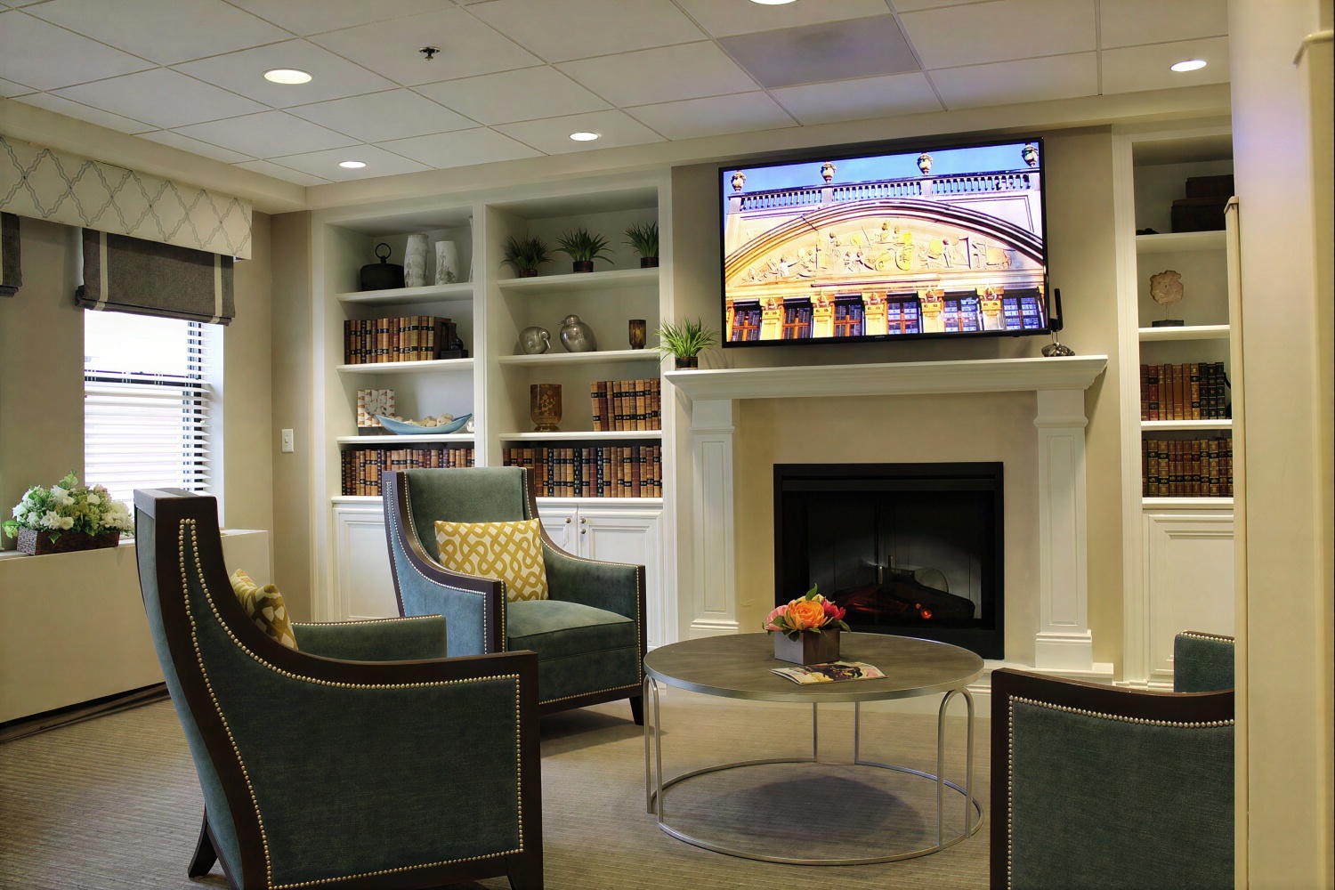 Cozy lounge with fireplace and armchairs