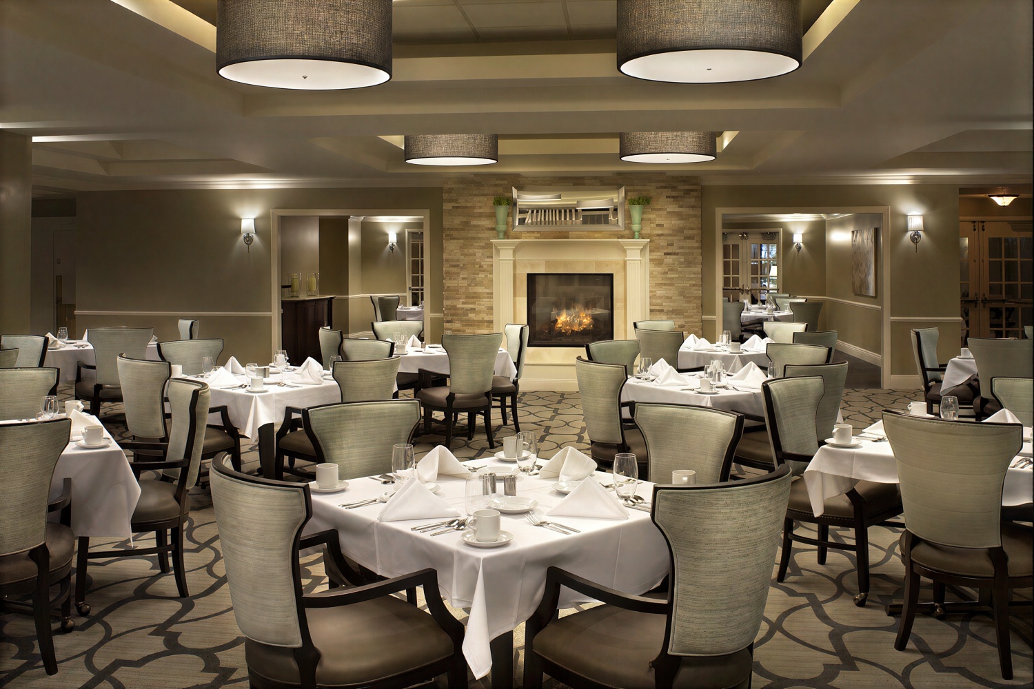 Elegant restaurant dining room with fireplace and tables