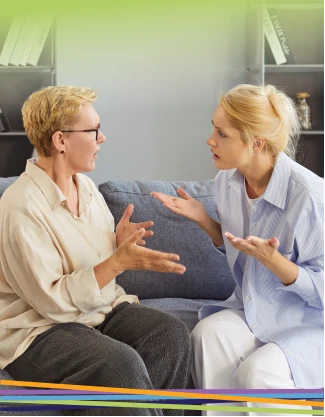 Two women having an intense discussion on a couch