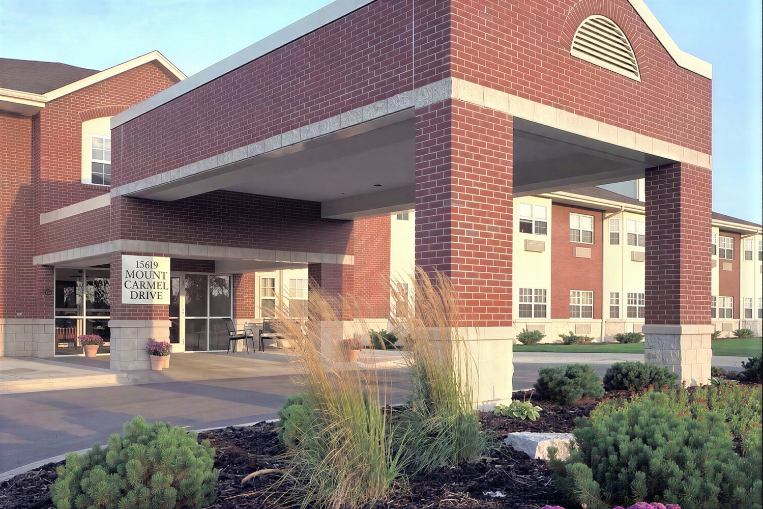 Brick building entrance at 15619 Mount Carmel Drive