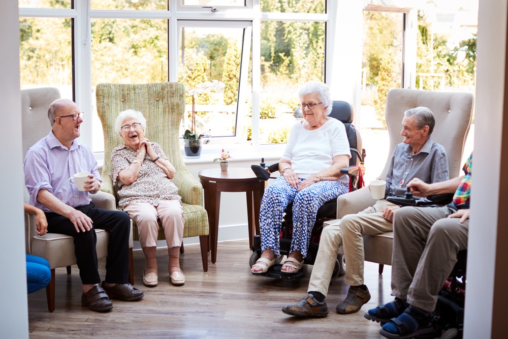 Seniors chatting in bright community room