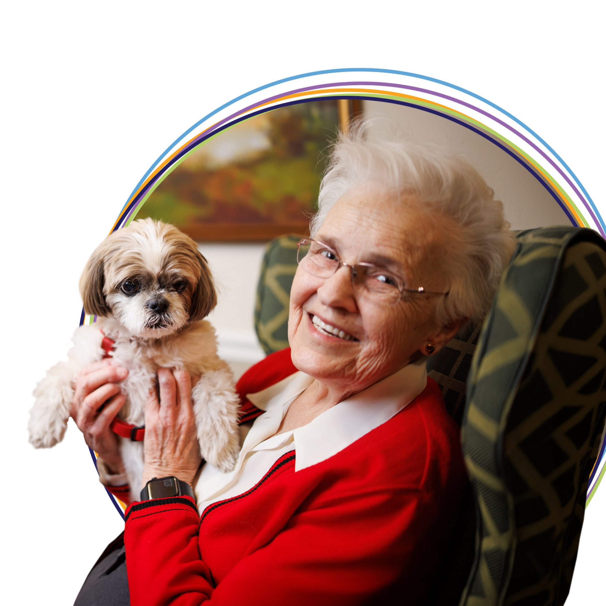 Smiling elderly woman holding small dog indoors