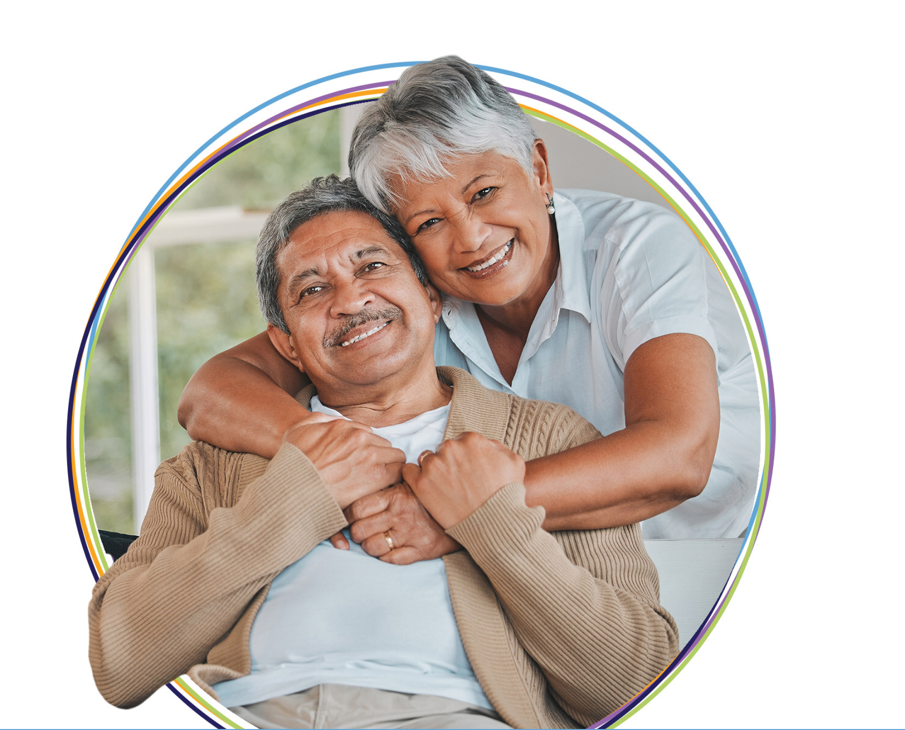 Smiling senior couple embracing at home
