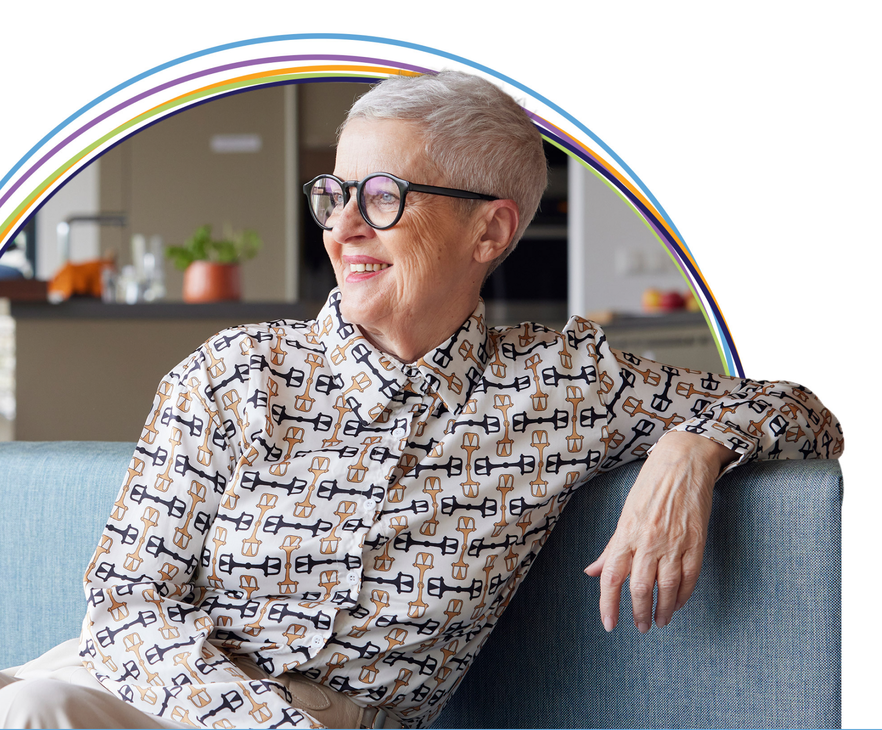 Smiling older woman with glasses on couch