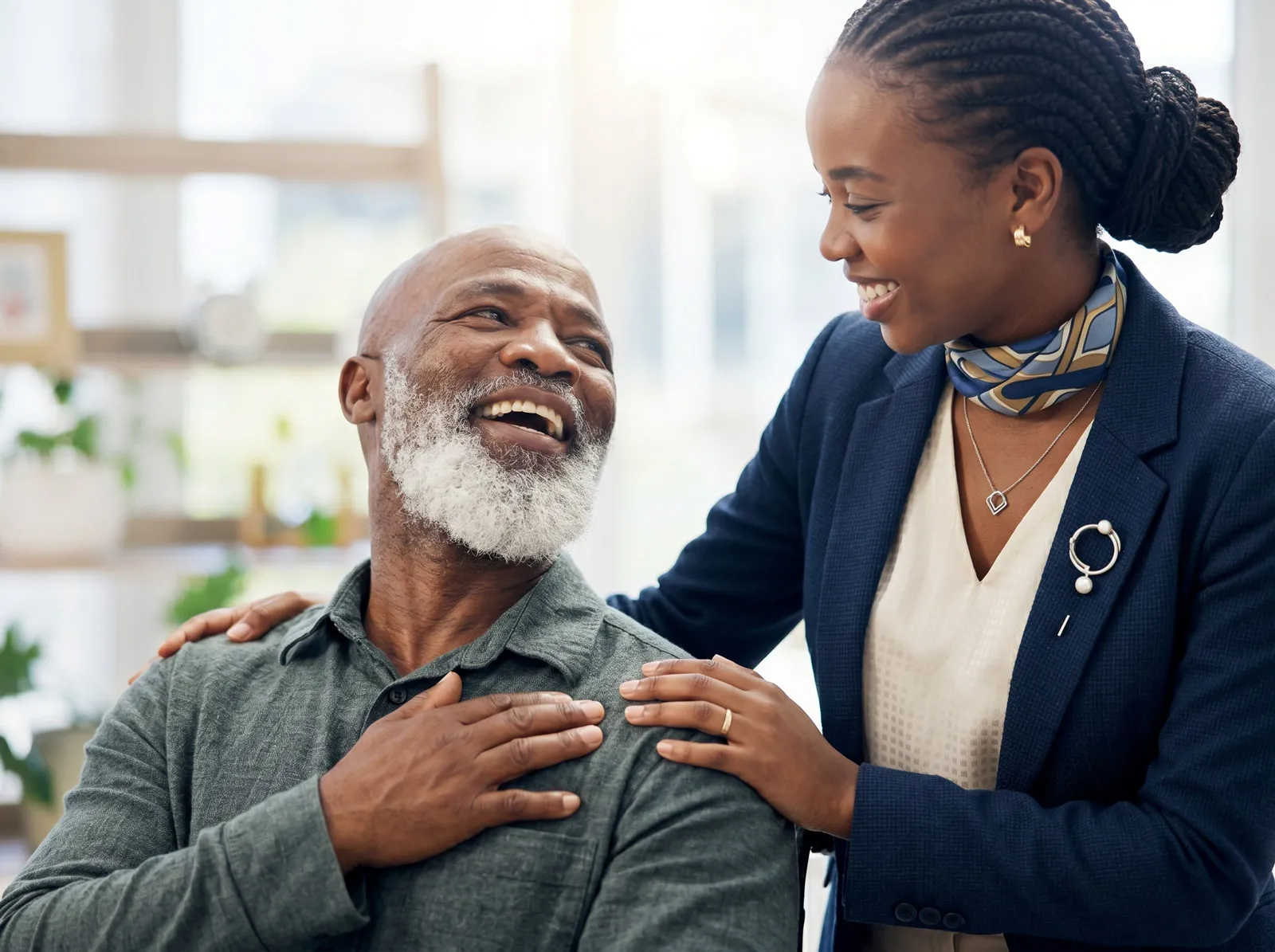 Smiling senior man with supportive professional woman