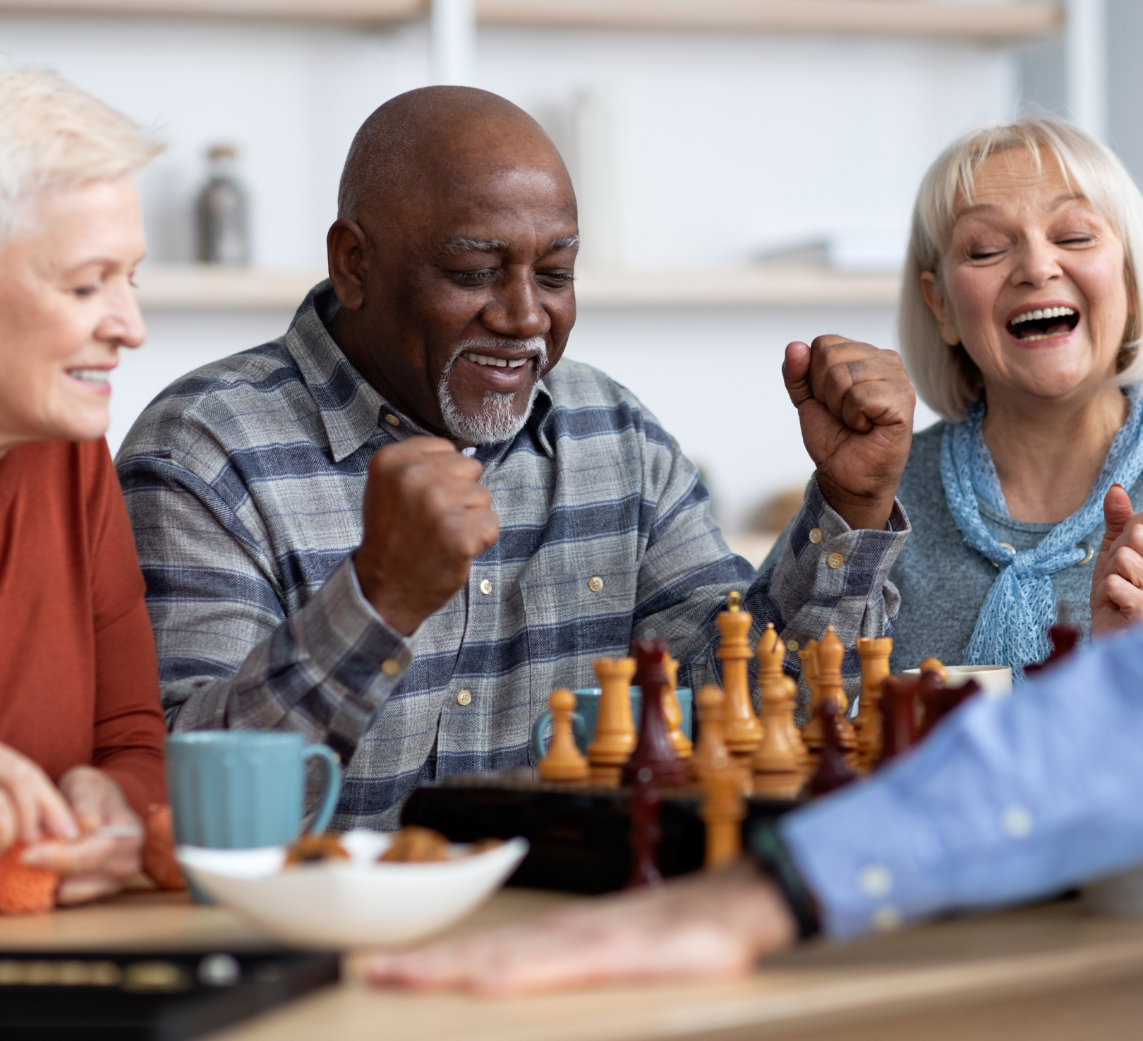 Seniors celebrating victory during a chess game