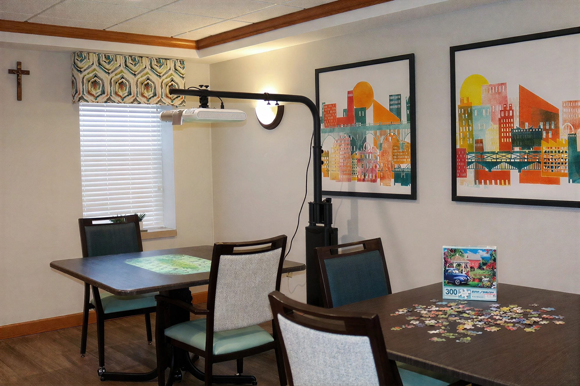 Cozy activity room with puzzles and framed art