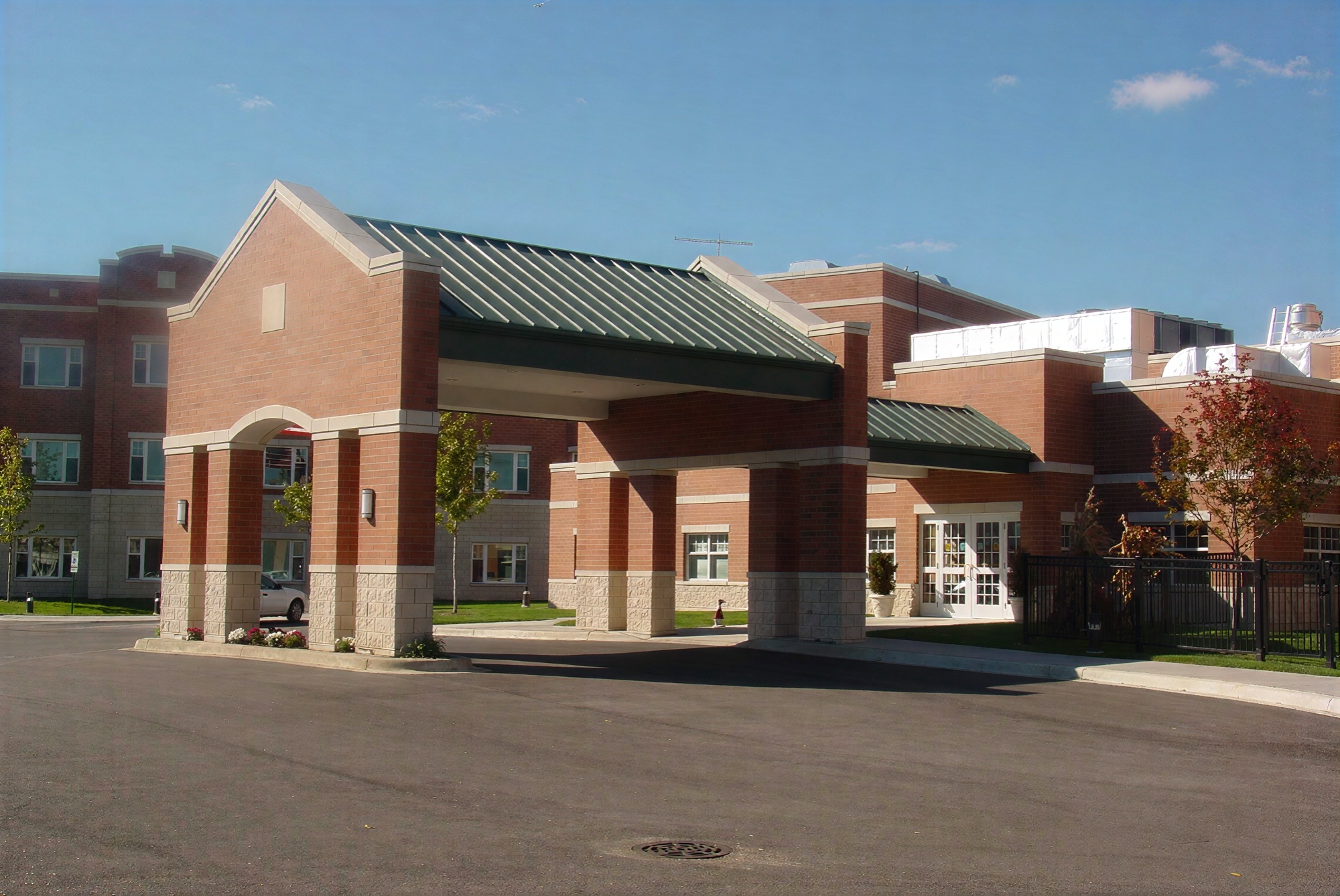 Modern brick building with covered entrance canopy