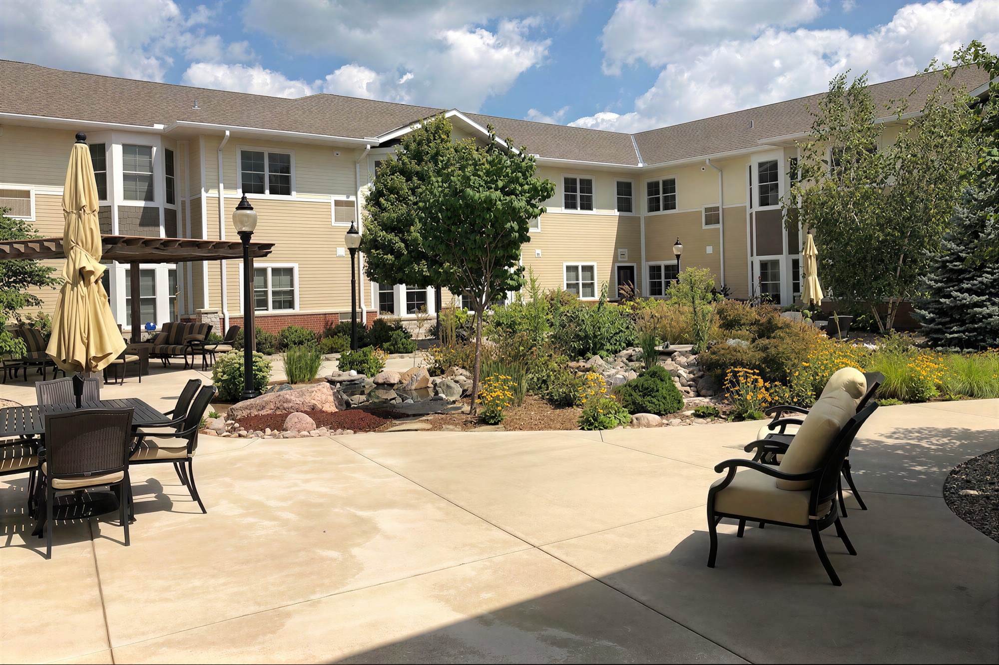 Landscaped courtyard with patio seating and fountain