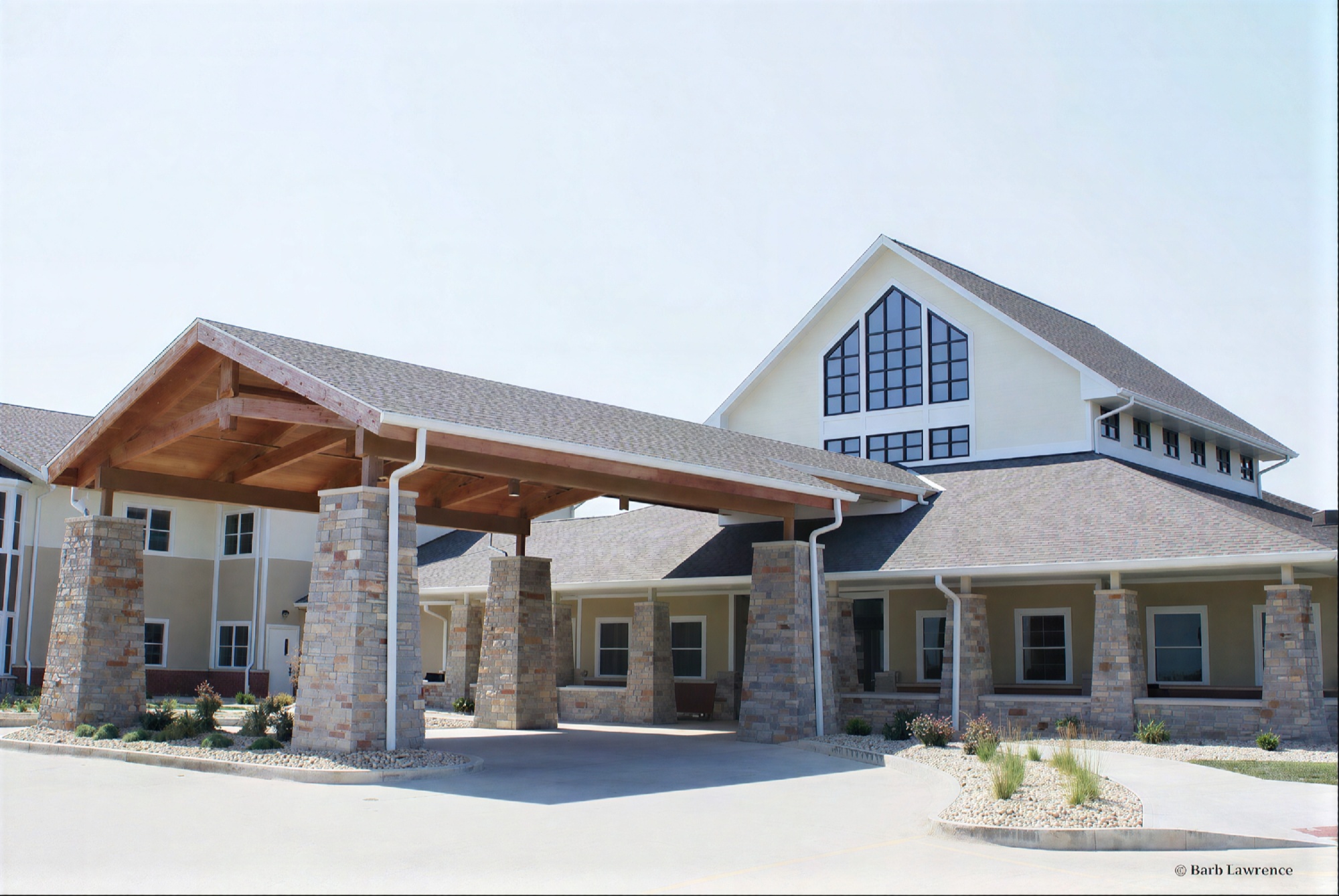 Modern building with stone columns and covered entrance